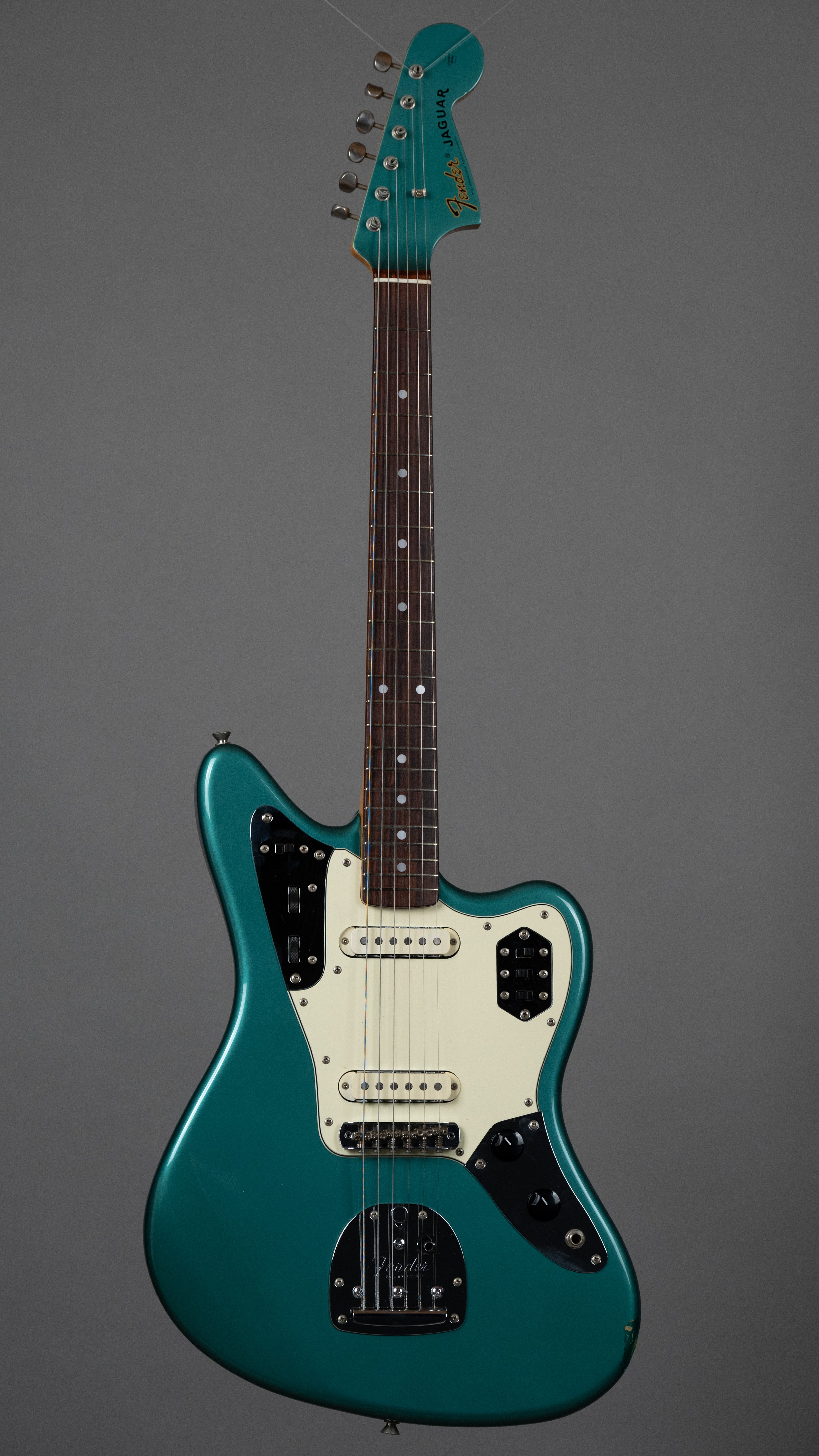 c1999 Fender JG66-85 Jaguar (Japan, Ocean Turquoise Metallic)