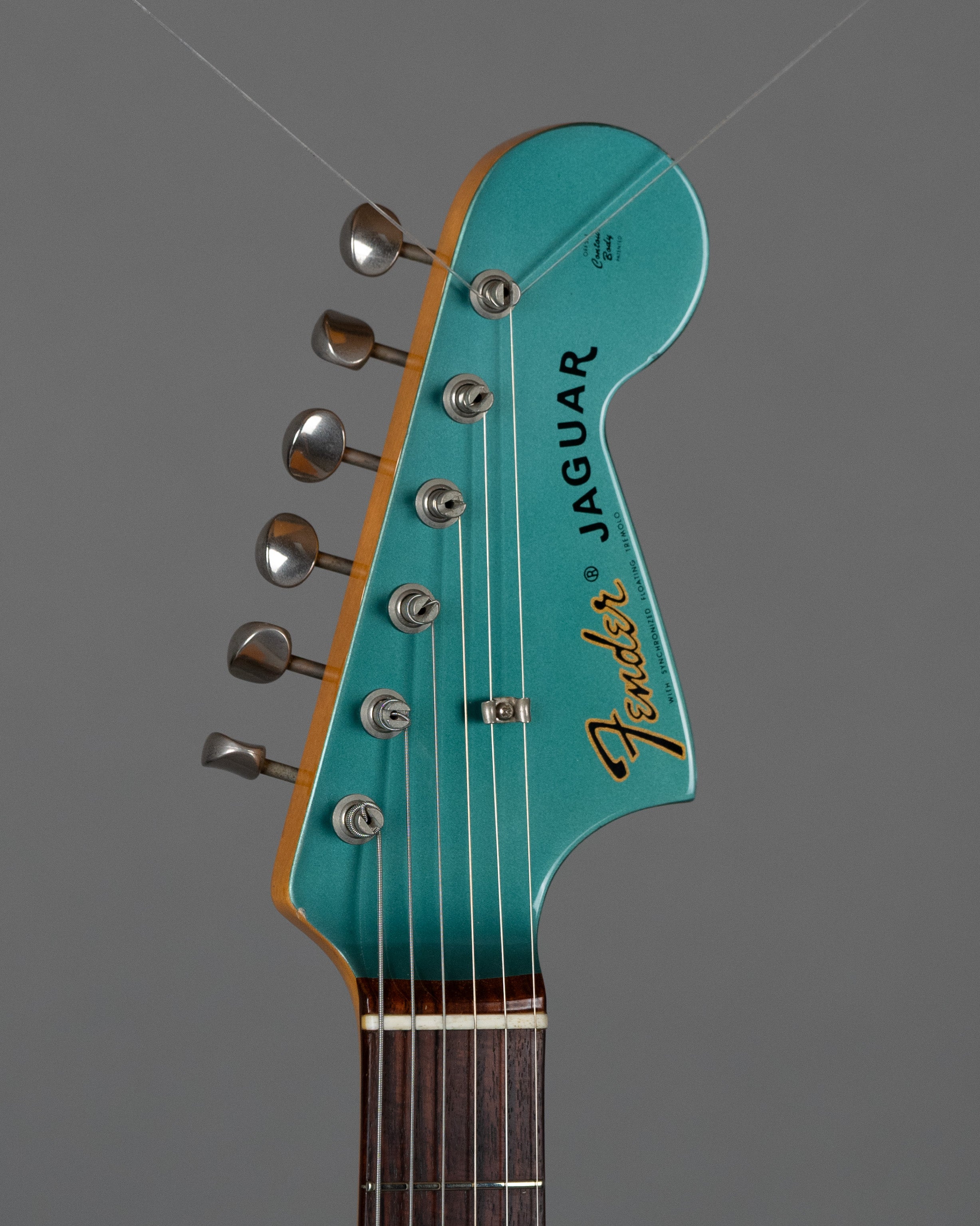 c1999 Fender JG66-85 Jaguar (Japan, Ocean Turquoise Metallic)