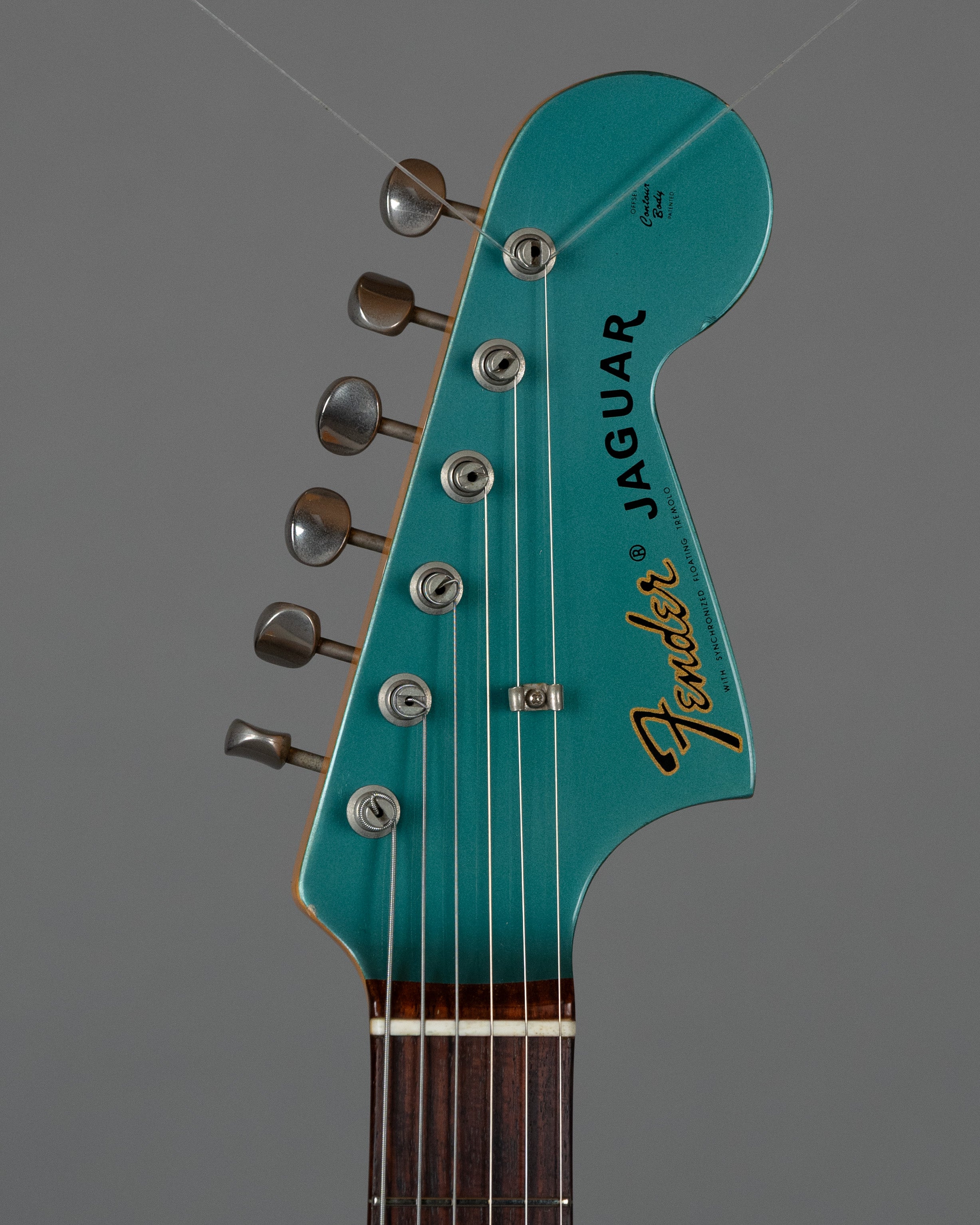c1999 Fender JG66-85 Jaguar (Japan, Ocean Turquoise Metallic)