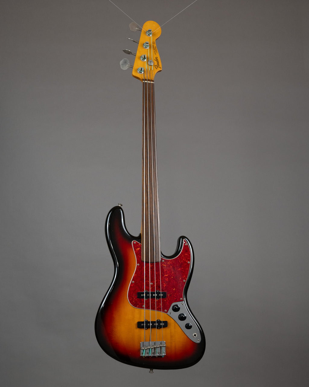 c1989 Fender JB62-60FL Unlined Fretless Jazz Bass (Japan, Sunburst)